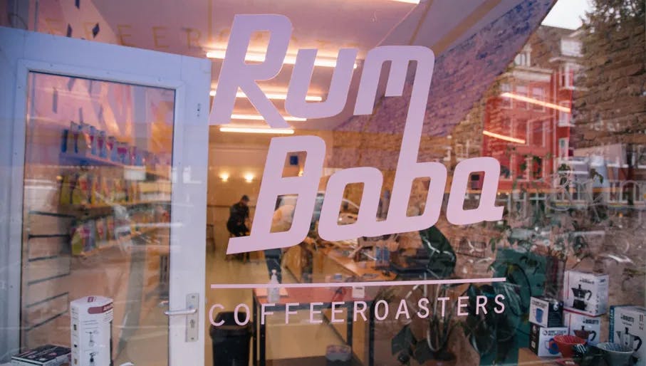 Rum Baba café exterior logo