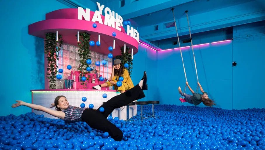 Woman falling into ball pit at Youseum Amsterdam