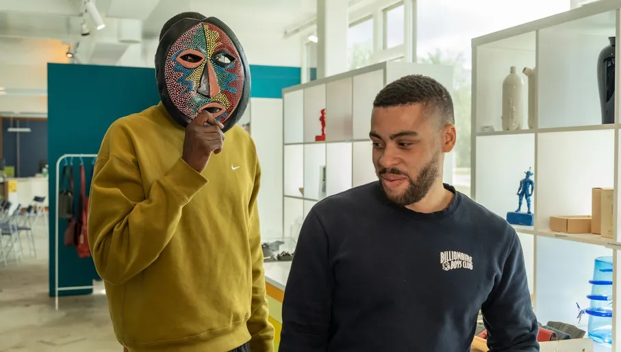 Two men enjoy their visit to CBK Zuidoost.