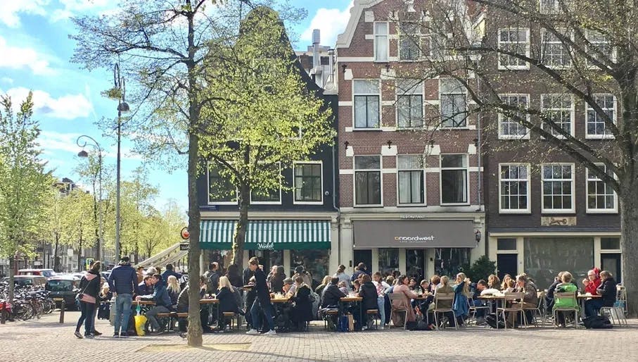 People sitting on the terrace of Winkel 43 on Noordermarkt.