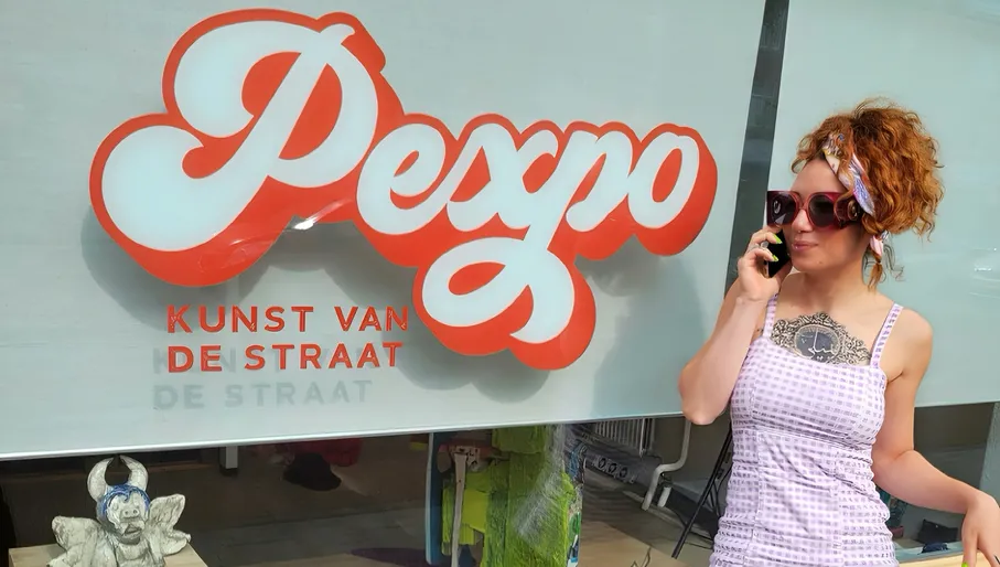 PEXPO lady posing in front of the window