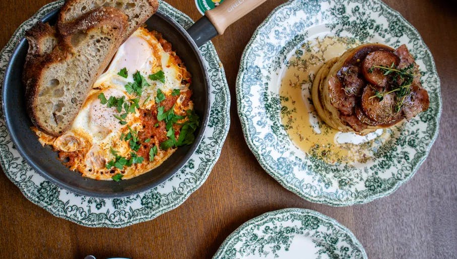 Stacked pancakes with bacon and shakshuka at Brunchdale